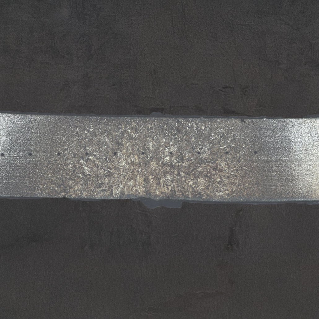 Corte transversal demonstrando uma solda ponto mal executada